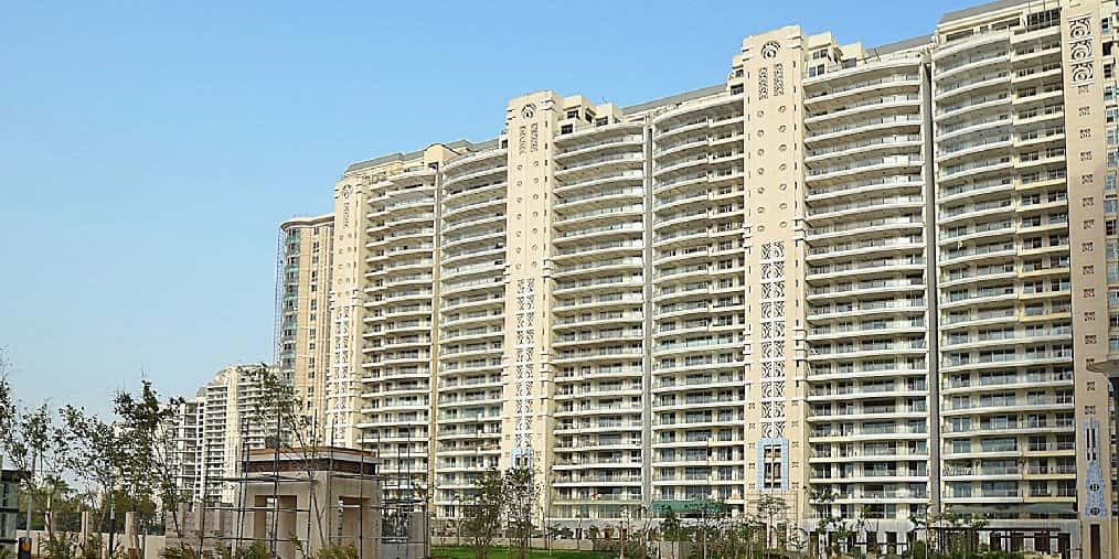 DLF The Magnolias — tall residential towers with a cream facade