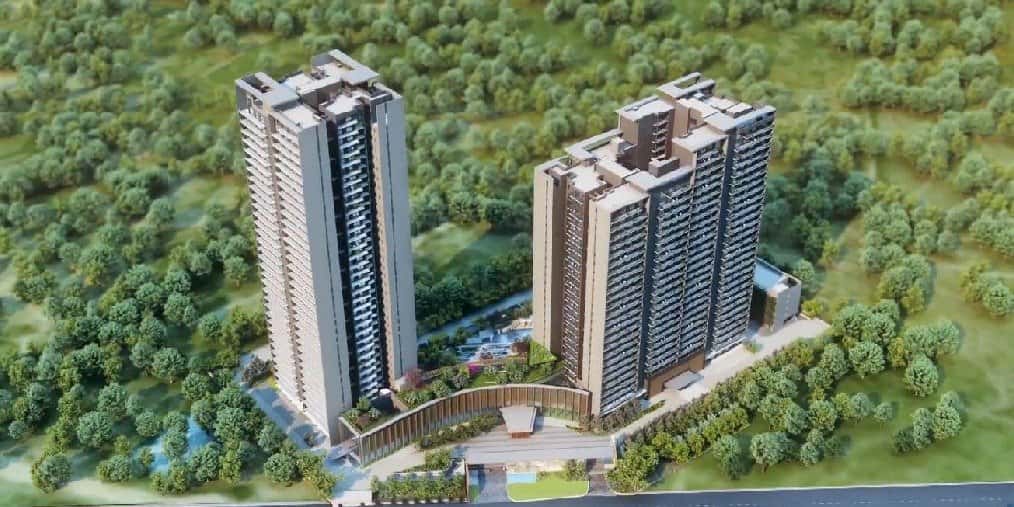Krisumi Waterfall Residences — aerial view of two towers amid greenery