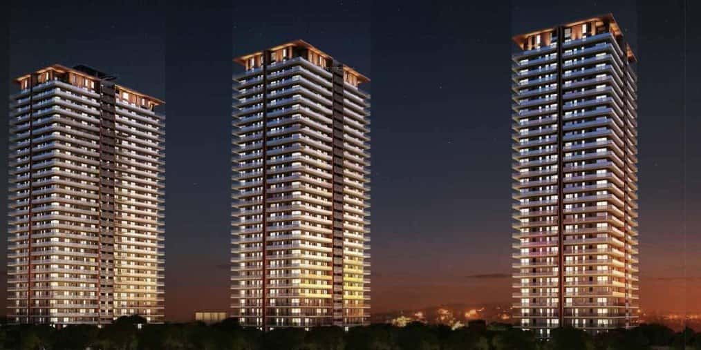 Mahindra Luminare — three towers lit at dusk