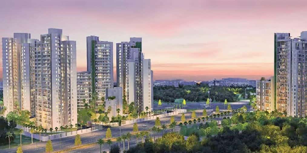Tata La Vida — towers and a green boulevard at sunset
