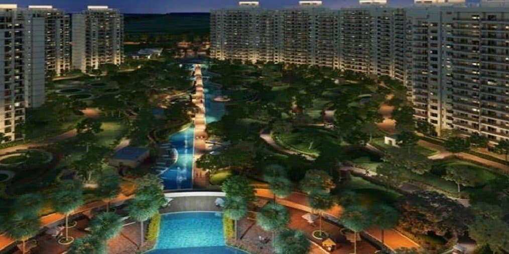 Central Park Resorts — towers around a landscaped central court with pool at dusk