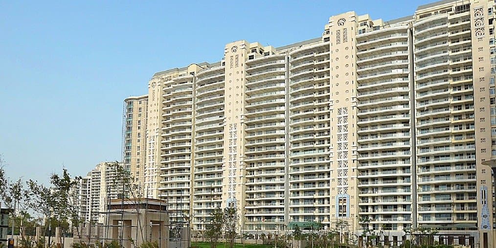 DLF The Magnolias — tall residential towers with a cream facade