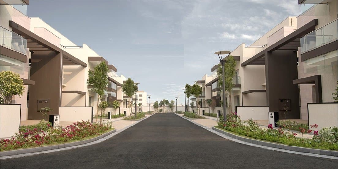 Sobha International City — street lined with villas